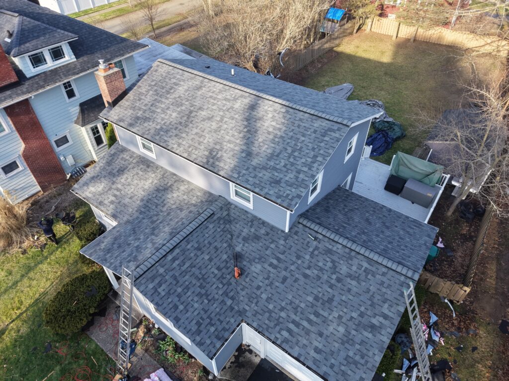 Estate Gray roof with light siding